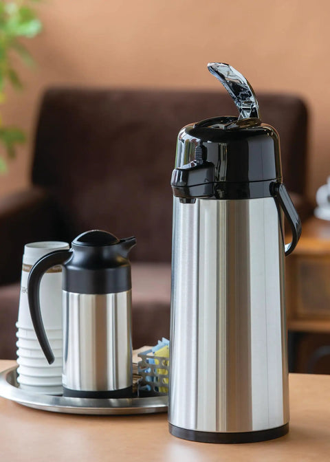 ECAL22S Eco Air Lever Airpot With Glass Vacuum Insulated Beverage Dispenser 2.2 Liter Thermal Coffee Carafe on table