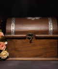 Wooden jewelry box with Vintage Style Mini Swing Arm Clasp Latch Set and antique bronze hinges, surrounded by flowers.