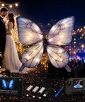 RC Flying Butterfly Drone With LED Lights And Realistic Flapping Wings hovering at night wedding scene with accessories.