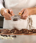 Chef using Nonstick Silicone Baking Mat For Cookies, Pro Grade Quality With Fiberglass Mesh For Even Heat, Reusable Oven Microwave And Freezer Safe, Easy Cleanup, Cookie Size, Bakes Like A Boss For Home Bakers And Pro Chefs to bake cookies.