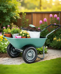 Two Wheel Wheelbarrow Yard Cart With Padded Handlebar And 14 Inch Pneumatic Tires For High Stability Heavy Duty Use Ideal For Moving Soil Mulch Gravel Plants Shrubs And Garden Debris Easy Assembly filled with plants and soil.