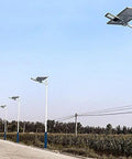 Tough As Nails Outdoor Solar Flood Lights With Smart Motion Sensor illuminating a driveway with sleek design and white poles.