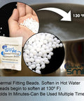 Hand holding Replacement Thermal Adhesive Beads For Fake Teeth near boiling water, waterproof white beads, 8 pack.