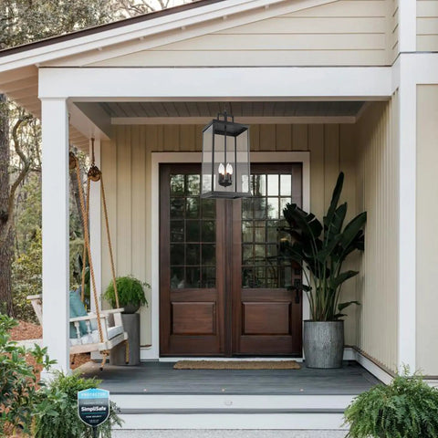 Large Twenty Five Inch Outdoor Pendant Light With Clear Glass And Sturdy Metal Build straight up above a porch entrance.