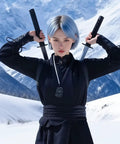Person wearing Lightweight PU Sword Carry Bag With Back Strap Waistband For Ninja Cosplay Dual Sword Holder in snowy mountains.