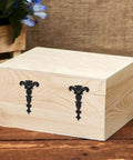 Wooden box with Antique T Strap Hinge Set Four Pieces Black Zinc Alloy Hinges With Screws for decorative touch.