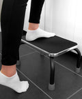 Person using heavy duty metal step stool for adults and seniors portable non slip foot stool with 250 lb capacity pre assembled