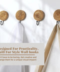 Four Pack Boho Rattan Wall Hooks Set With Distressed Wood Frames, holding coats and towels on a wall.