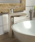 Modern Low Flow One Handle Tall 10 Inch Bathroom Sink Faucet In Brushed Nickel EcoRight Water Saving Design Delivers Up To 1.2 GPM And Saves Water And Energy Includes Aerator Pop Up Drain Ceramic Cartridge And Temperature Limiter in bathroom setting