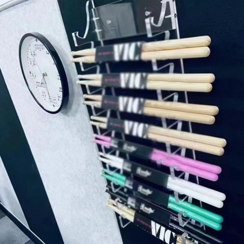 Keep Your Kit Tidy And Looking Fly With This Premium Clear Acrylic Drumstick Holder Display Rack holding multiple drumsticks.