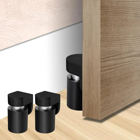 Magnetic Door Stopper And Holder For Secure Doors Under Two And A Half Inches Heavy Duty Stainless Steel Anti Rust Stops Slams And Keeps Doors From Slamming Steady And Reliable For Home And Office Black Finish 1 Pack installed on floor.