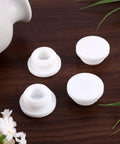 Top Shelf Rubber Sink Overflow Cover Cap 3 Pack White Silicone Drain Guard For Kitchen And Bathrooms on wooden surface.