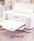 Gemini II Electric Die Cutting And Embossing Machine With Pause And Rewind, 9x12.5 Inch, shown on a table with cutting platform