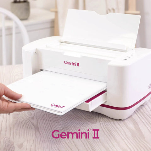 Gemini II Electric Die Cutting And Embossing Machine With Pause And Rewind, 9x12.5 Inch, shown on a table with cutting platform
