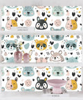 Slick Pastel Woodland Peel And Stick Wallpaper With Cute Animal Head Prints displayed on shelves, perfect for playrooms.