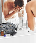 Man uses sink near Fighter Jets Print Large Capacity Go To Travel Toiletry Bag Waterproof Cosmetic Organizer.