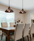 Industrial Barn Pendant Light Farmhouse Hanging Fixture over dining table in kitchen with adjustable cord and vintage design.