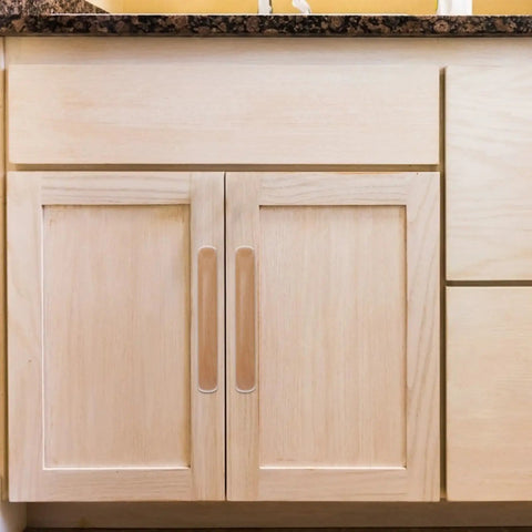 Close-up of kitchen cabinet with Beef Up Your Cabinets With Beech Wood Door Pulls And Drawer Handles, 96mm lacquer finish installed.