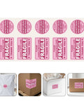 Pro Grade Fragile Shipping Stickers 3 By 2 Inch Red Copper Plate Warning Labels With Reliable Adhesion For Moving And Transport Mailers And Supplies Quick Identification To Prevent Breakage And Safe Handling During Transit. Pink fragile shipping sticker sheet with round and rectangular labels on boxes