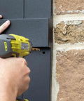Installing Lifetime Vinyl Open Louver Shutters With Cathedral Top Center Mullion on brick wall using drill and Shutter Lok Hardware