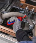 Electrician using Ratcheting Cable Stripping Knife For Electricians With Three Cutting Areas For Round And Longitudinal Cuts Guide Shoe Protects Insulation Five And Three Quarters Inch Blade Heavy Duty Workhorse Multifunction Tool on thick cable
