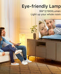 Couple on sofa with TV and Slender 39 Inch Floor Lamp With Remote Control, RGB Color Changing LED Lights For Vibe Mood Lighting nearby