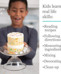 Child holding a decorated cake with the Playful Chef Kids Cake Decorating Kit With Pans Reusable Pastry Bags and Recipes.