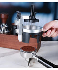 Real Talk This Rotating Espresso Coffee Distributor Hits Different With Twelve Precision Needles leveling coffee grounds in hand.