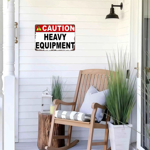 Caution Heavy Equipment Warning Metal Sign 8x12 Inch Aluminum Wall Decor on porch with chair and plants visible