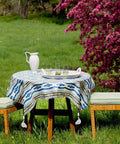 Outdoor table with tablecloth held by Clip On Tablecloth Weights Set Of Four Heavy Duty Cast Iron Bird Weights With Stainless Steel Clips