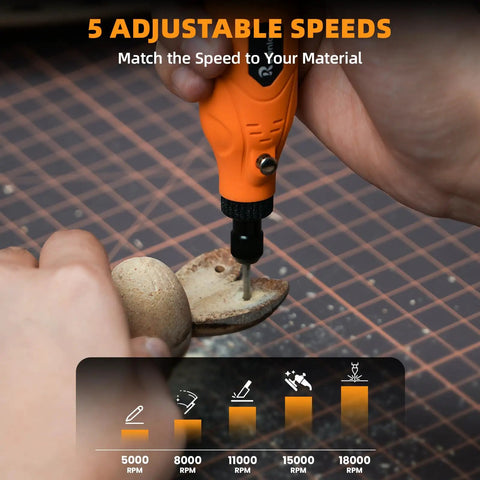 Close-up of Nitty Gritty Mini Cordless Rotary Tool adjusting speed dial, engraving wood at 18000 RPM.