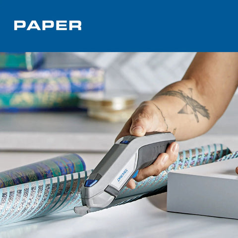 Dremel 4V Cordless Electric Scissors With USB Rechargeable Battery And Two Sharp Hssc Blades For Cutting Cardboard Fabric And Paper Effortlessly Ideal For Home Diy Tasks And Crafting Projects Made Easy In One Hand cutting wrapping paper.