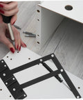 Black heavy-duty lift-up self-closing hinge being installed on white drop-leaf panel; 1 pair with screws.