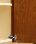 Heavy duty cabinet door hinges installed on kitchen wood cupboard for smooth and quiet operation, showing stainless steel build and durability.