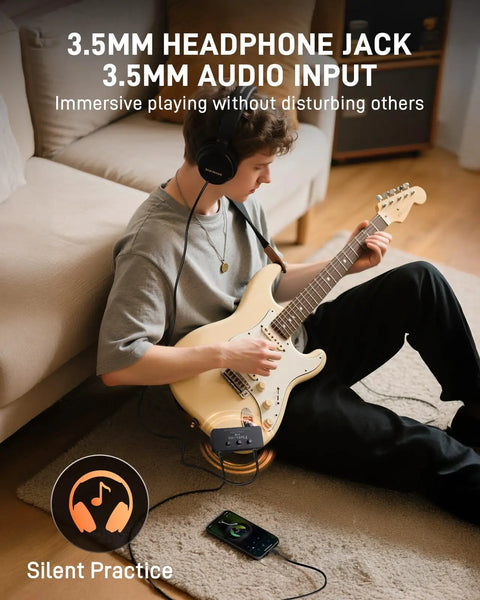 Person using Mini Guitar Headphone Amplifier With 3.5mm Aux Jack For Silent Practice And On The Go Travel Real Analog Tone Distortion Timbre
