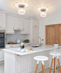 2 Pack Mini Semi Flush Mount Ceiling Lights With Clear Shade, Modern Crystal Ceiling Lamps for Indoor Use in a bright kitchen.
