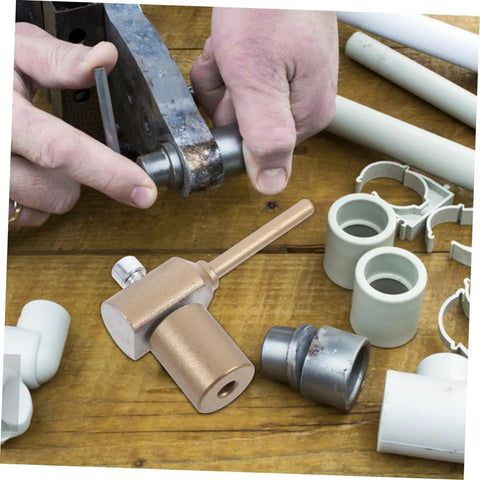 Person using PPR Repair Tool With Hot Melt PE Welding Rods for Quick Leak Fixes, DIY pipe fittings on wooden table