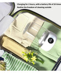 No Strings Attached Cordless Portable Washing Machine, Quiet And Slick Mini Washer For Dorms And RVs inside a suitcase with clean towels.