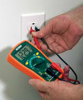 MiniTec Autoranging Digital Multimeter With 600V AC DC, 10A Current, measuring voltage from an outlet with protective holster