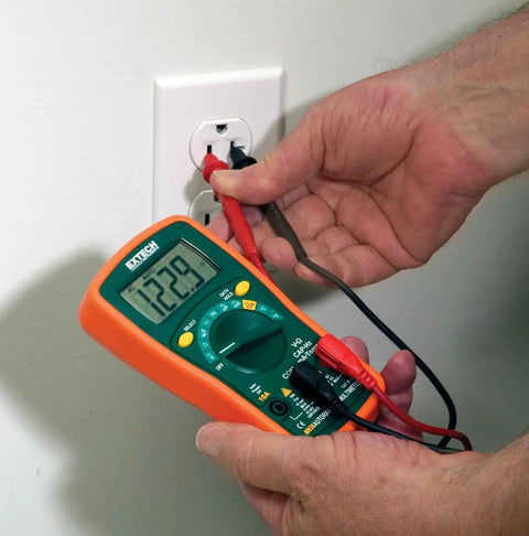 MiniTec Autoranging Digital Multimeter With 600V AC DC, 10A Current, measuring voltage from an outlet with protective holster