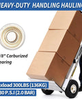 Two Pack 10 Inch Pneumatic Tire And Wheel Set For Hand Trucks And Garden Carts 4.10/3.50-4 With 2.25 Inch Offset Hub And 5/8 Inch Axle Bore Sealed Bearings Replacement Wheel Kit For Dolly Wagon And Utility Cart displayed on hand truck with boxes