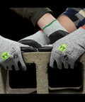 ANSI A4 Liquid Repellent Nitrile Work Gloves With DuraBlend 13 Gauge Shell Foam Palm Coating gripping concrete block