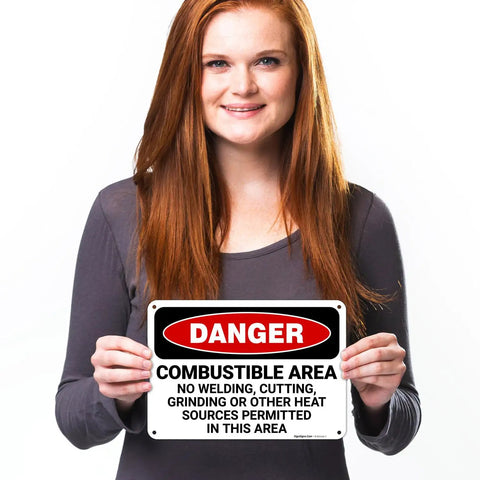 Person holding Danger Combustible Area No Welding Or Other Heat Sources Allowed OSHA Sign 10x7 Inches Aluminum.040 Rust Free