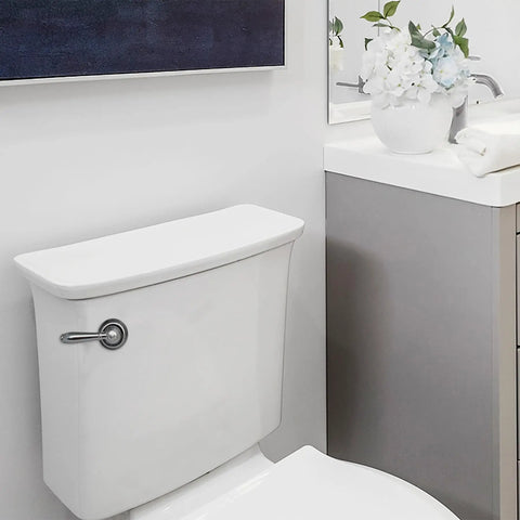 Bathroom scene featuring the Strongarm Universal Toilet Tank Lever In Chrome For Front Angled Side Left Or Right Mount Toilets Fits 2 Inch And 3 Inch Flappers Easy Install Faucet Style installed on a white toilet.