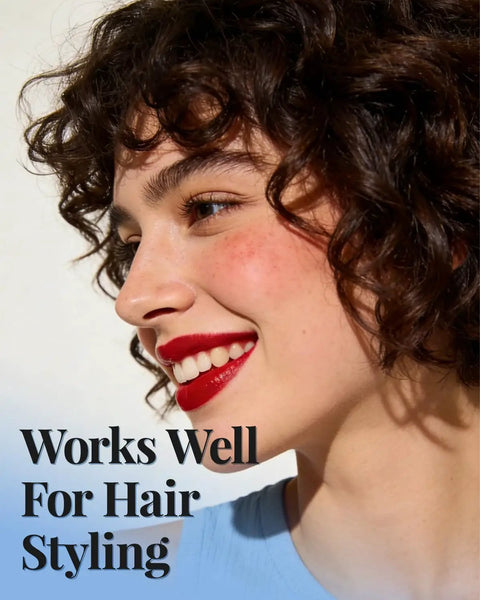 Close-up of a smiling woman with curly hair wearing red lipstick demonstrating hair styling techniques with 50 Pack Heavy Duty Metal Pin Curl Clips With Three Essential Loc Combs For Strong Braid Support Flex And Twist Mastery That Slays On Every Crown.