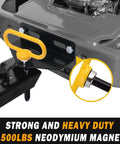 Close-up of Heavy Duty Magnetic Hitch Pin One Half Inch For Lawn Mowers And Trailers One Handed No Fuss Easy Hook On Off No Rust Strong Magnet Gate Pin For ATVs Lawn Tractors Towing Cargo Fits Standard One Half Inch Receivers Yellow installed on a lawn tractor hitch.