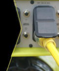 Beefed Up Outdoor Extension Cord 50 Feet In 10 Gauge SJTW with Lighted End and Molded Plug connected to a generator panel.