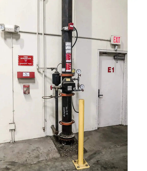 High Vis Wall Case For Fire Sprinkler Shut Off Tool Heavy Duty Polycarbonate with mounted gauges and signage in a commercial setting.