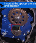 Double-Headed cam locking tool, black metal, installed on Harley engine timing gear