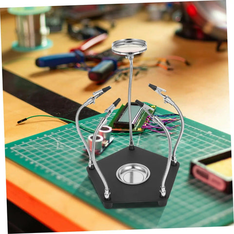 LED Magnifying Lamp With Soldering Third Hand Tool on a workbench with flexible arms and iron holder for precise PCB repair.